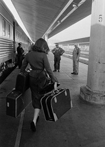 Girl Carrying Luggage at Train Station